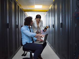 Image showing technicians working together on servers