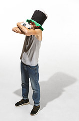 Image showing The young football fan - man hugging soccer ball isolated on a white background