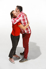 Image showing Full body portrait of hugging couple with smile. Caucasian models in love