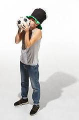 Image showing The young football fan - man hugging soccer ball isolated on a white background