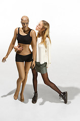 Image showing Fashion woman body. The woman hugging mannequin, perfect woman dream concept