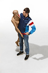 Image showing Fashion woman body. The man hugging mannequin, perfect woman dream concept