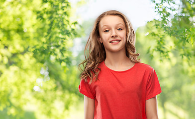 Image showing smiling teenage girl over natural background