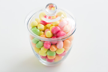 Image showing close up of glass jar with colorful candy drops