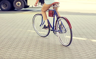 Image showing hipster man riding fixed gear bike