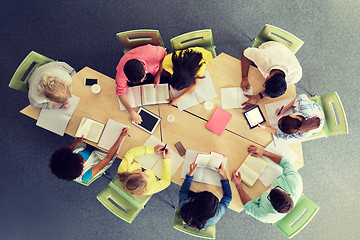 Image showing group of students with tablet pc at school library