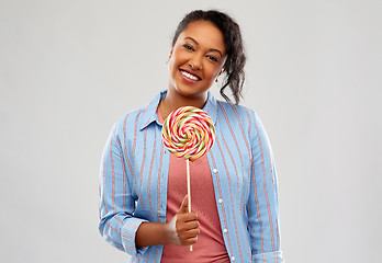 Image showing happy african american woman with big lollipop