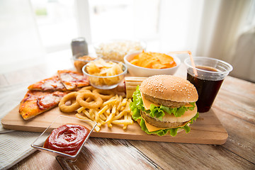 Image showing close up of fast food and cola drink on table