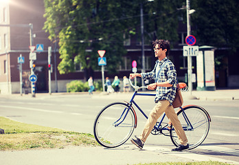 Image showing young man with fixed gear bicycle on crosswalk