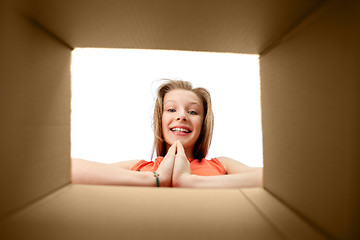 Image showing happy girl looking into open gift box