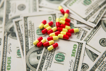 Image showing close up of pills or drugs and dollar cash money