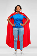 Image showing happy african american woman in superhero red cape