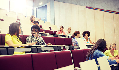 Image showing group of students with notebooks at lecture hall