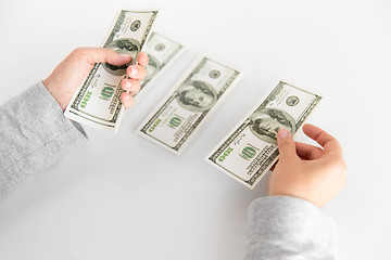 Image showing close up of woman hands counting us dollar money