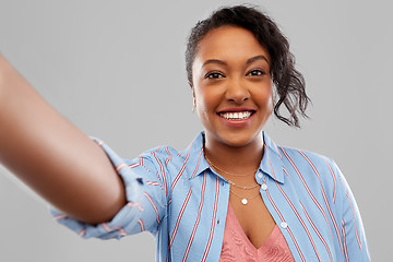 Image showing happy african american woman taking selfie