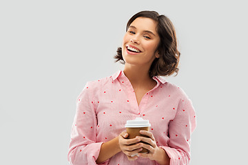 Image showing happy young woman in pajama with cup of coffee