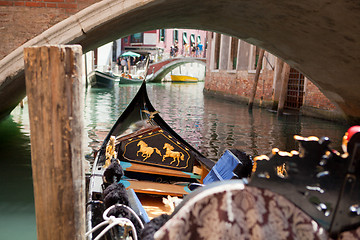 Image showing Walking on the traditional italian gondola by the canal.