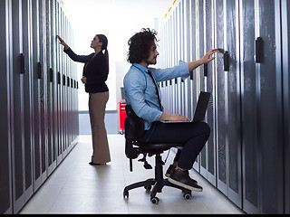 Image showing technicians working together on servers