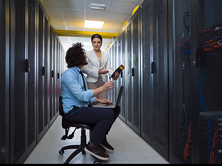 Image showing technicians working together on servers