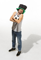 Image showing The young football fan - man hugging soccer ball isolated on a white background