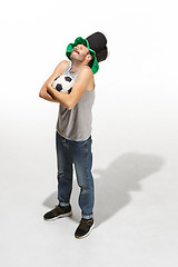 Image showing The young football fan - man hugging soccer ball isolated on a white background