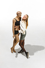 Image showing Fashion woman body. The woman hugging mannequin, perfect woman dream concept