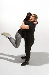 Image showing Full body portrait of hugging couple with smile. Caucasian models in love