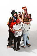 Image showing Football fans hugging with beers on white background