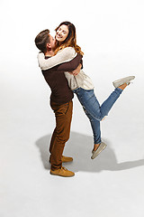 Image showing Full body portrait of hugging couple with smile. Caucasian models in love