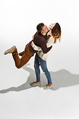 Image showing Full body portrait of hugging couple with smile. Caucasian models in love