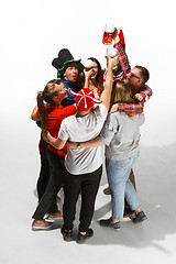 Image showing Football fans hugging with beers on white background