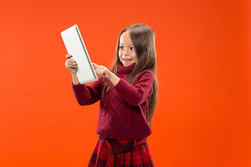 Image showing Teen girl with laptop. Love to computer concept. Attractive female half-length front portrait, trendy studio backgroud.