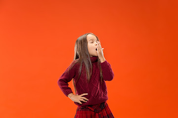 Image showing Beautiful bored teen girl bored isolated on studio background