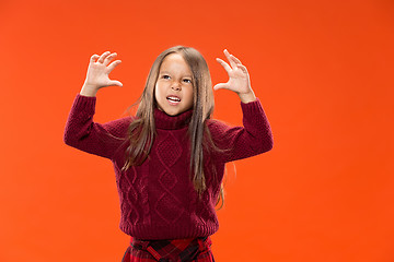 Image showing Portrait of angry teen girl on studio background