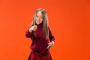 Image showing The happy teen girl pointing to you, half length closeup portrait