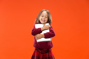 Image showing Teen girl with laptop. Love to computer concept. Attractive female half-length front portrait, trendy studio backgroud.