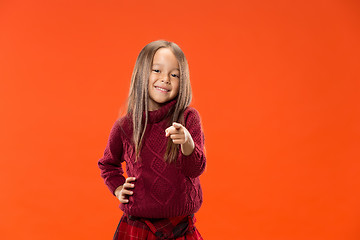 Image showing The happy teen girl pointing to you, half length closeup portrait