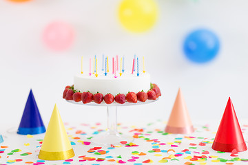 Image showing birthday cake with candles and strawberries