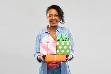 Image showing happy african american woman with birthday gifts