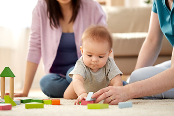 Image showing happy family with baby boy playing at home