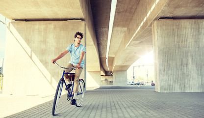 Image showing young hipster man riding fixed gear bike