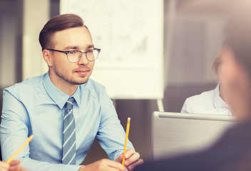 Image showing smiling business people meeting in office