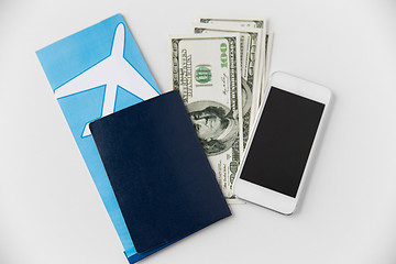 Image showing air ticket, money, smartphone and passport