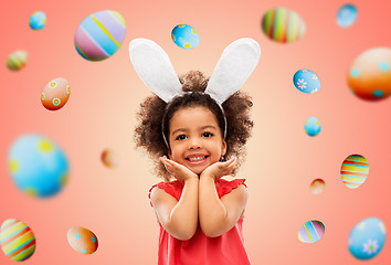 Image showing happy little girl wearing easter bunny ears posing