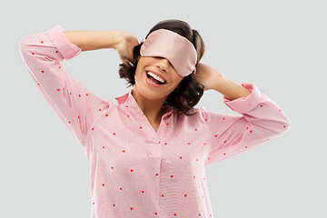 Image showing happy young woman in pajama and eye sleeping mask