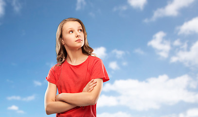 Image showing teenage gir with crossed arms over sky