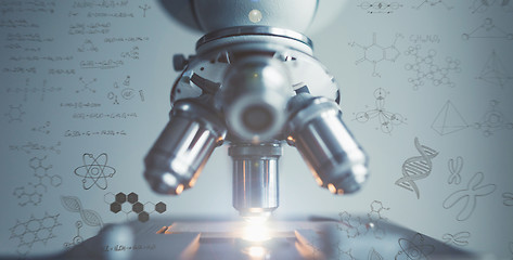 Image showing Close up of examining of test sample under the microscope with effects