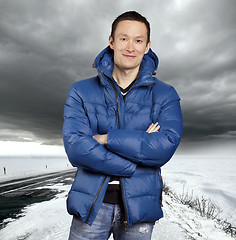 Image showing Asian man stand on snow road in winter