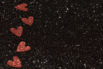 Image showing Hearts over black abstract background with bokeh