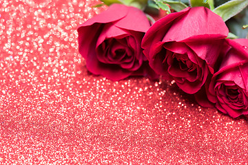 Image showing Roses over red abstract background with bokeh